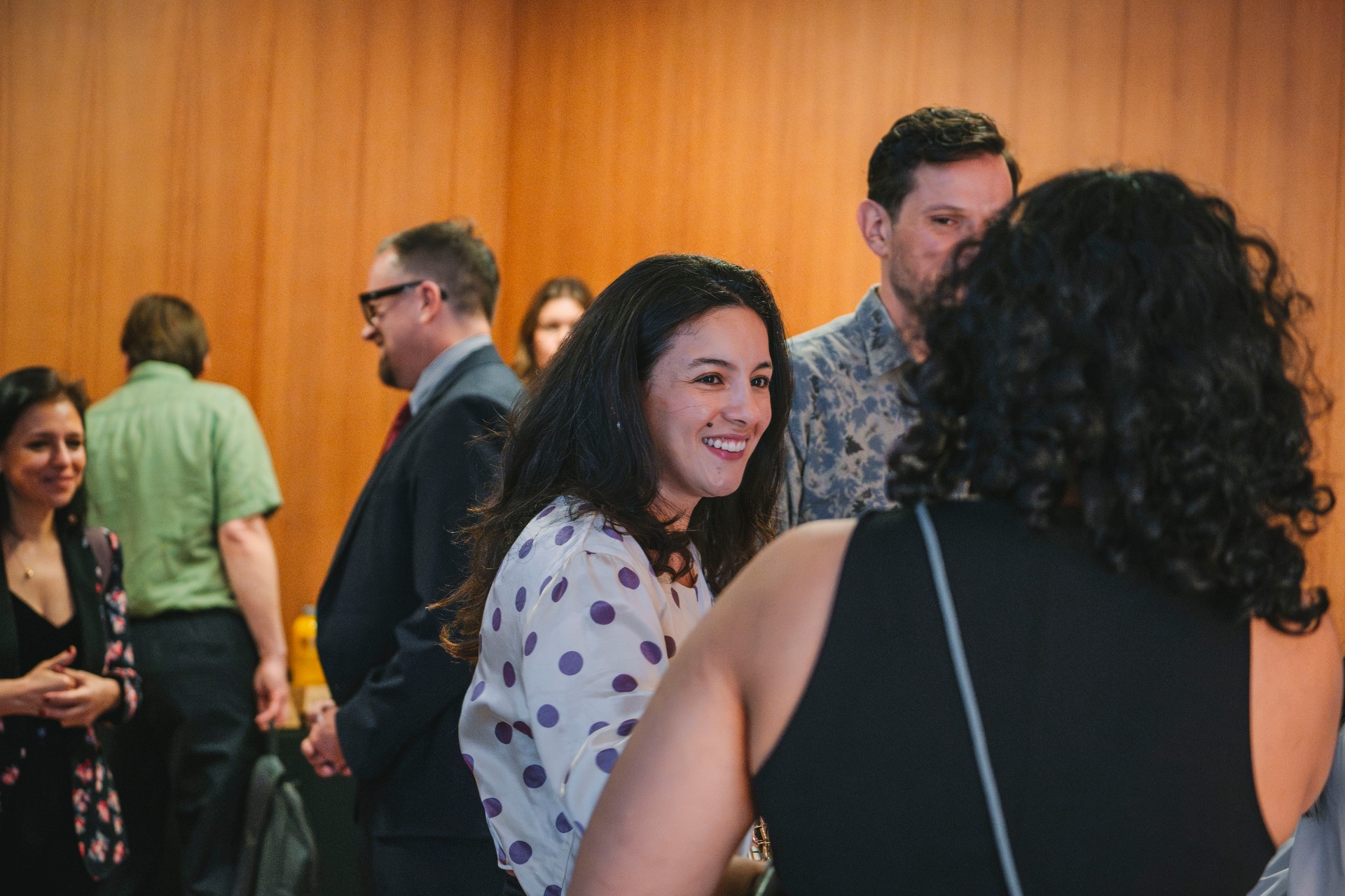 Mentee smiling during a networking moment